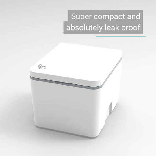 Compact white plastic dry separation toilet with closed lid and rounded edges.